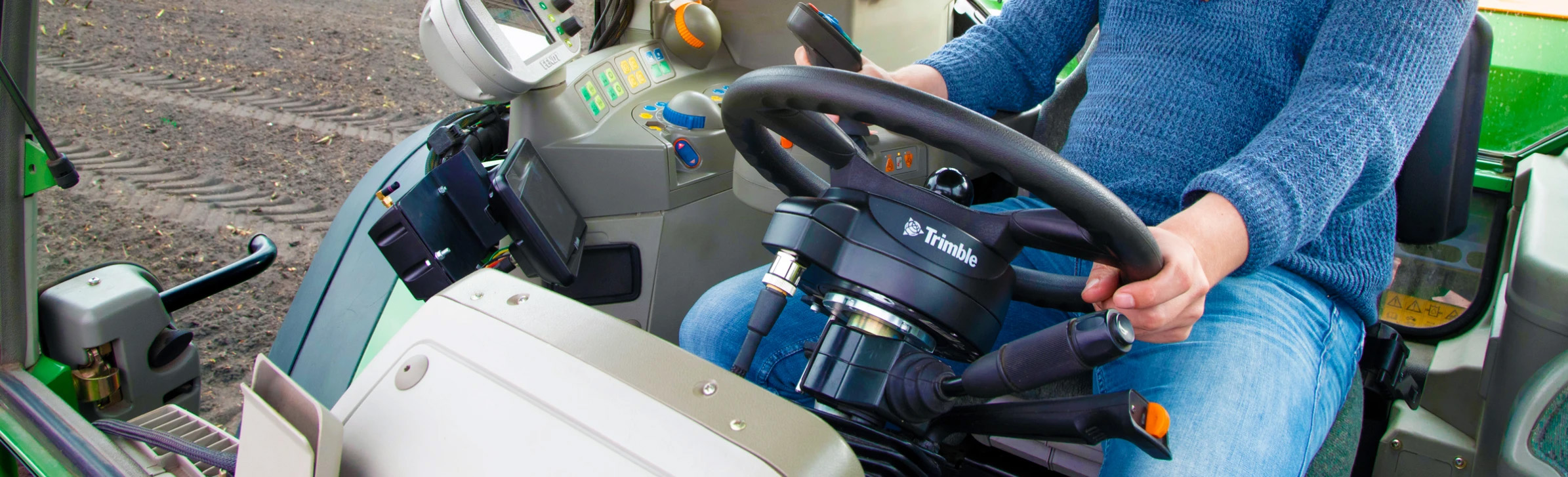 agriculture-products-ezpilot-farmer-steering-incab-2400x730-1